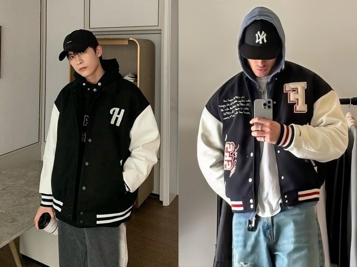 Lớp áo hoodie xám bên trong và áo khoác Varsity Jacket đen bên ngoài, tạo hiệu ứng layering đẹp mắt